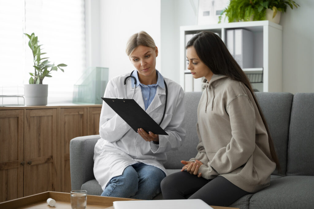 Doctor explaining acute vs chronic cannabis use to a patient.